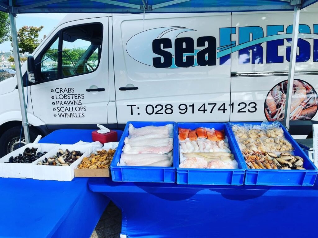 SeaFresh seafood display beside the branded SeaFresh van